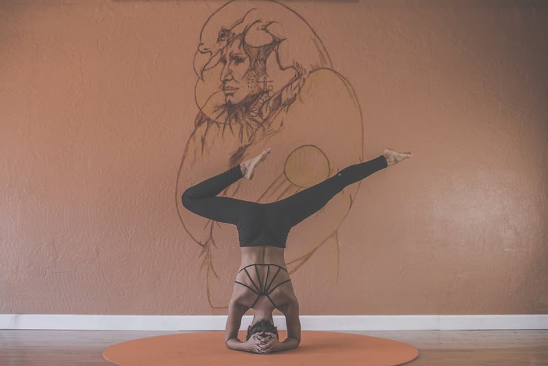Woman in a balancing yoga pose